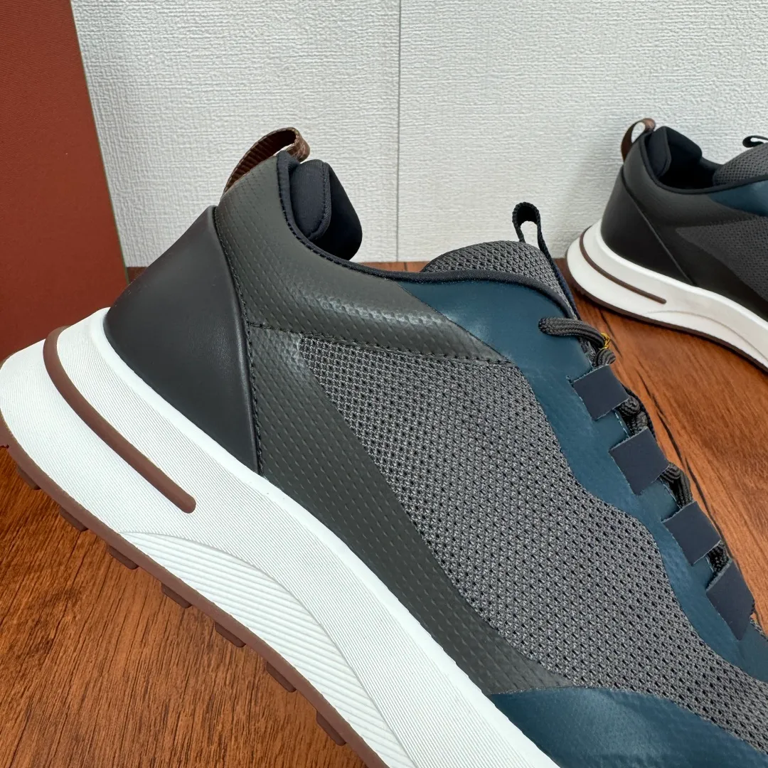 Batch 760 Loro Piana mesh cowhide stitching casual sports men's shoes LP jogging shoes OEM original soles feel free to enter the counter! This casual shoe is knitted from Wind fiber, giving it a unique three-dimensional effect. The unique silhouette narrows slightly at the midsection and is embellished with nappa leather details. The lightweight rubber sole and studs on the edge enhance traction and stability, and functional details full of modern aesthetics add a sporty style to the shoe. The upper uses a hot-melt edge-sealing process. The lightweight technical material of the Kummel-colored rubber outsole is inlaid with cushioning pads on the inside of the sole to distribute the weight more evenly and reduce the load during walking. The leather eyelets are directly set on the upper fixed to the sole to ensure stability. The rear is equipped with cushioning pads to improve wearing comfort. The full package of the counter comes with a shoelace insole. Multiple colors available! Fabric: 100% nylon Decoration: 100% cow leather Accessories: 100% polyurethane Size: 39-40-41-42-43-44 Standard leather shoe size (38/45 can be customized and returns and exchanges are not supported) Item number: FAM1718 gray blue